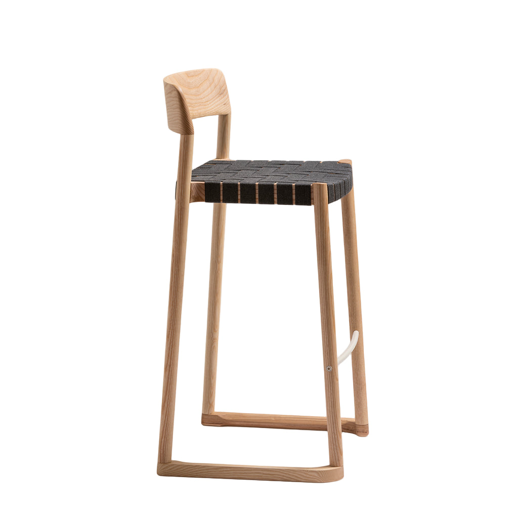 Wooden bar stool with a woven seat on a white background