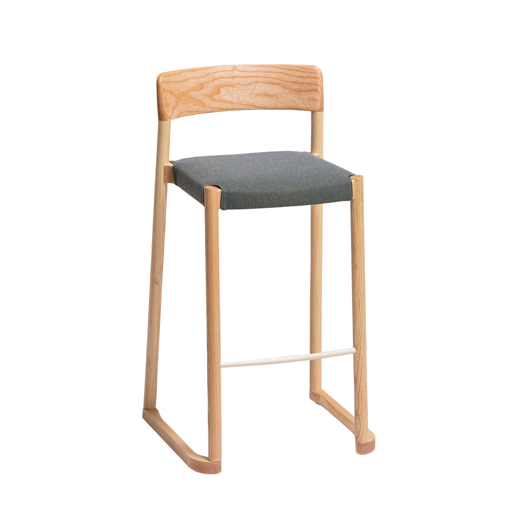 Bar stool with wooden frame and gray cushioned seat on a white background