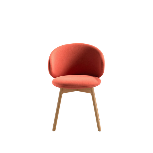 Red chair with wooden legs on a white background