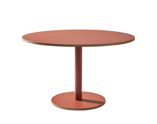 Round table with a single leg on a white background
