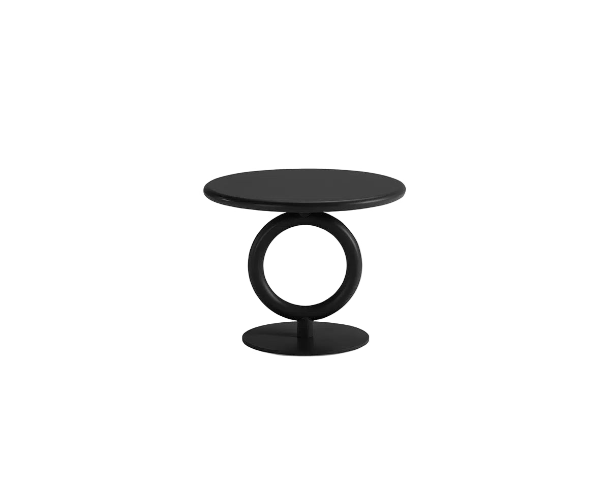 Modern black side table with circular design on a white background