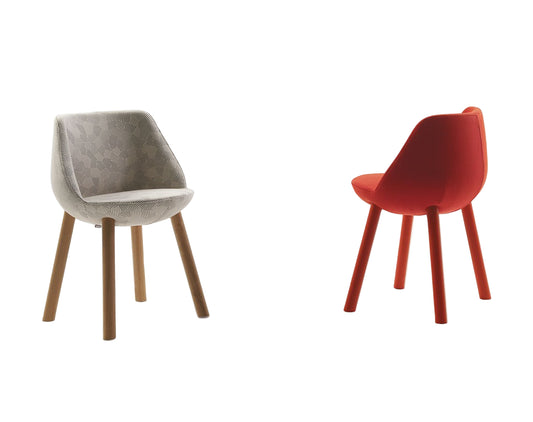 Two chairs, one gray and one red, on a white background