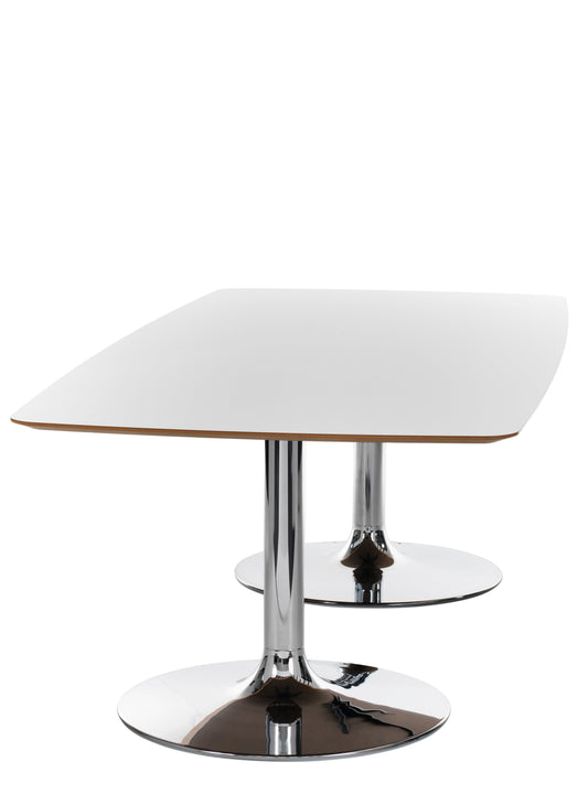 Modern side table with white top and chrome base on a white background
